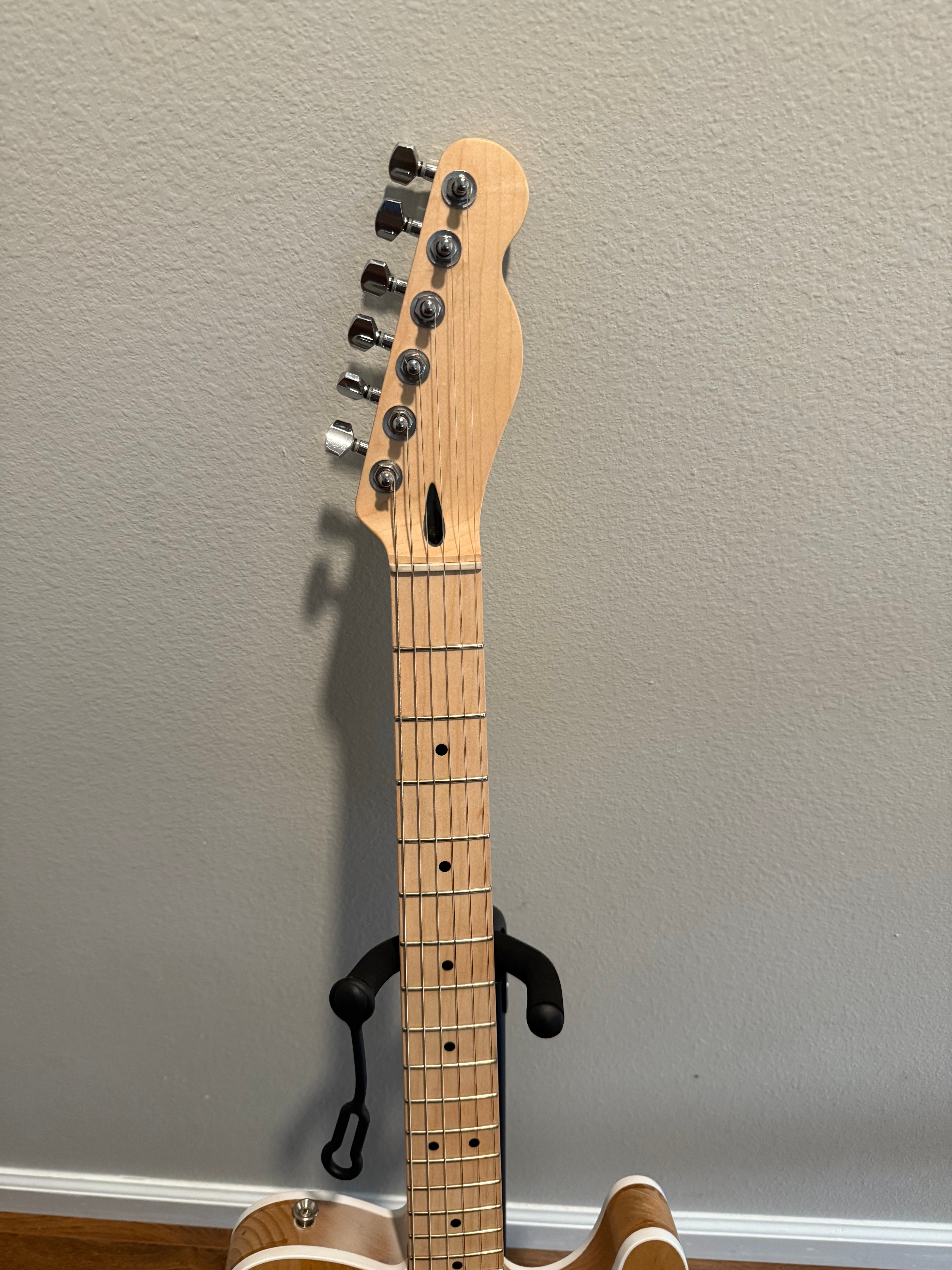 Custom Telecaster guitar by Palm Harbor Music featuring a sleek design and vibrant finish.