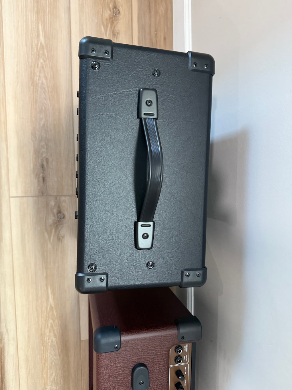 Palm Harbor Music NGW20 electric guitar amplifier with sleek design and control knobs, showcasing its durable construction.