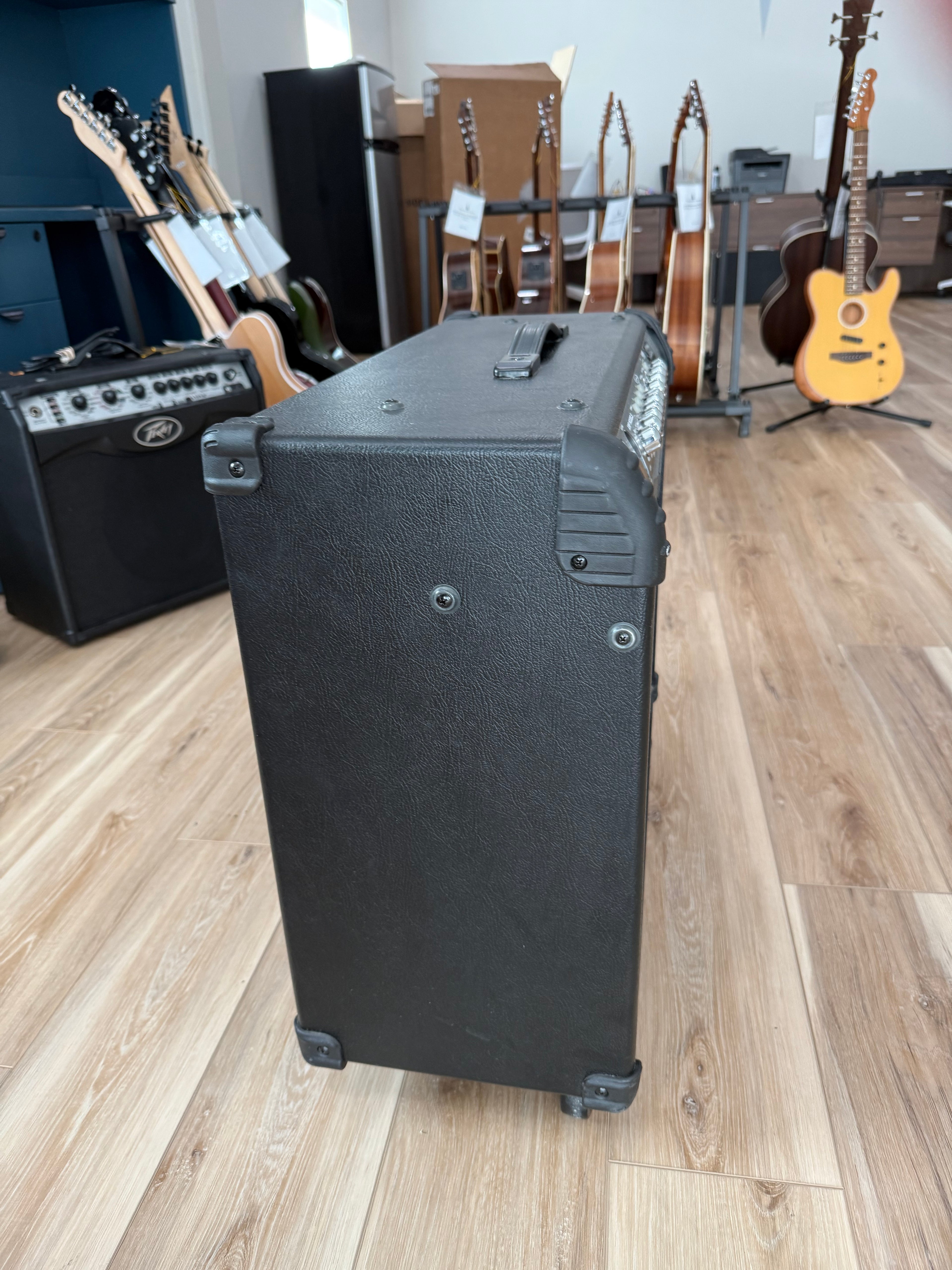 Line 6 Spider III 150W stereo guitar amplifier with dual 12-inch speakers, used condition, featuring a sleek black design.