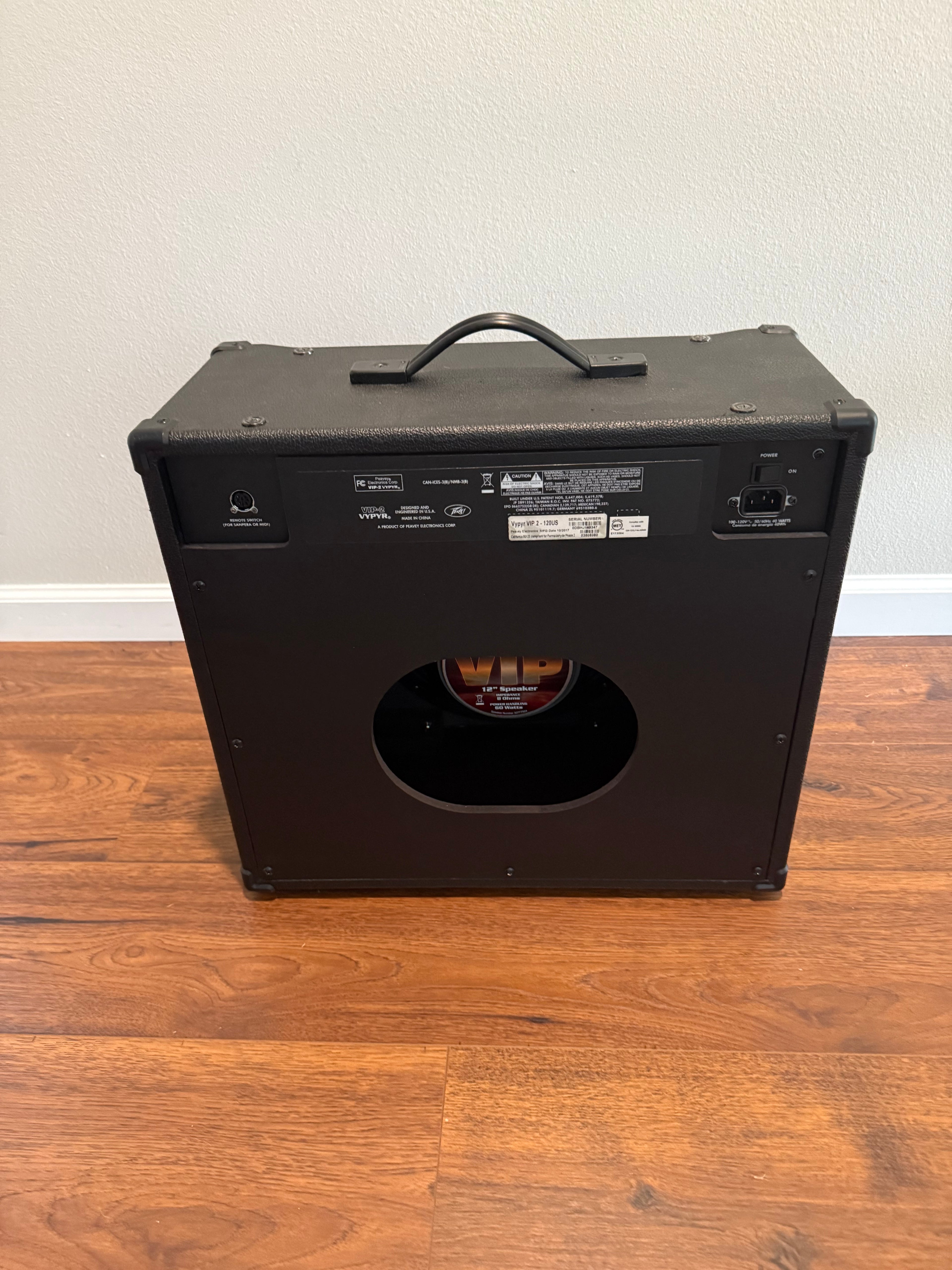 Used Peavey Vypyr VIP 2 40W combo amp showcasing controls and speaker grille in a music studio setting.