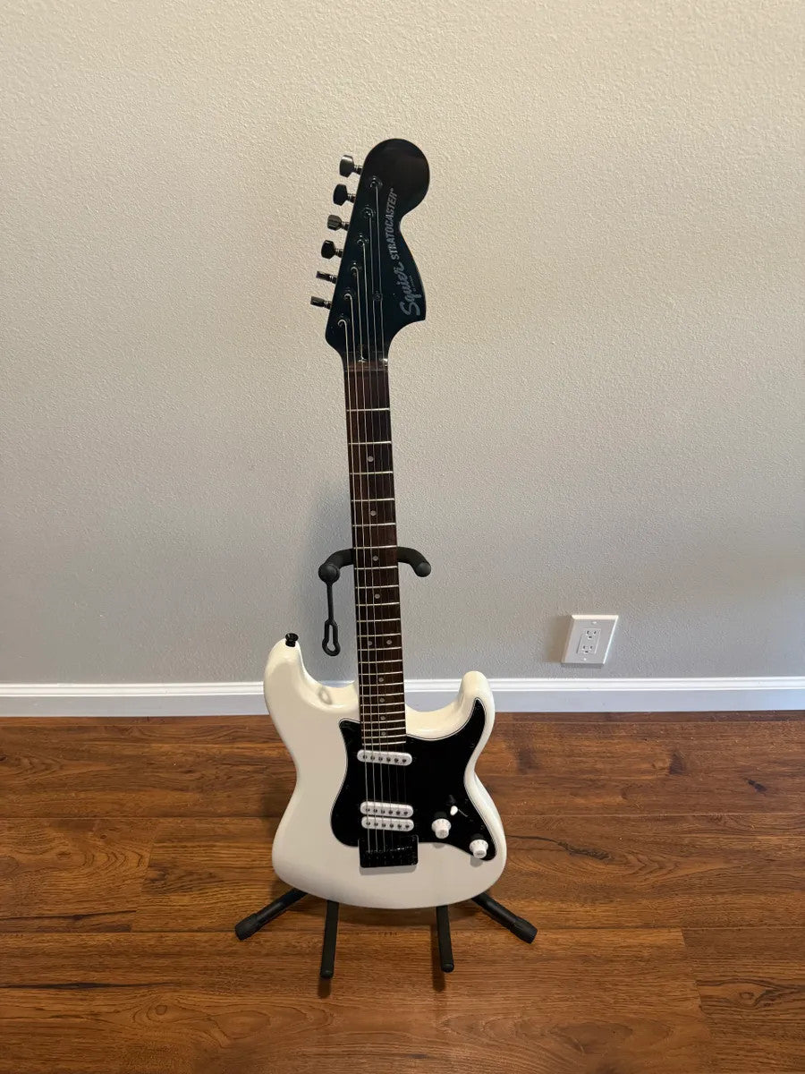 Used Squier Contemporary Stratocaster in pearl white finish with a sleek body and classic design details.