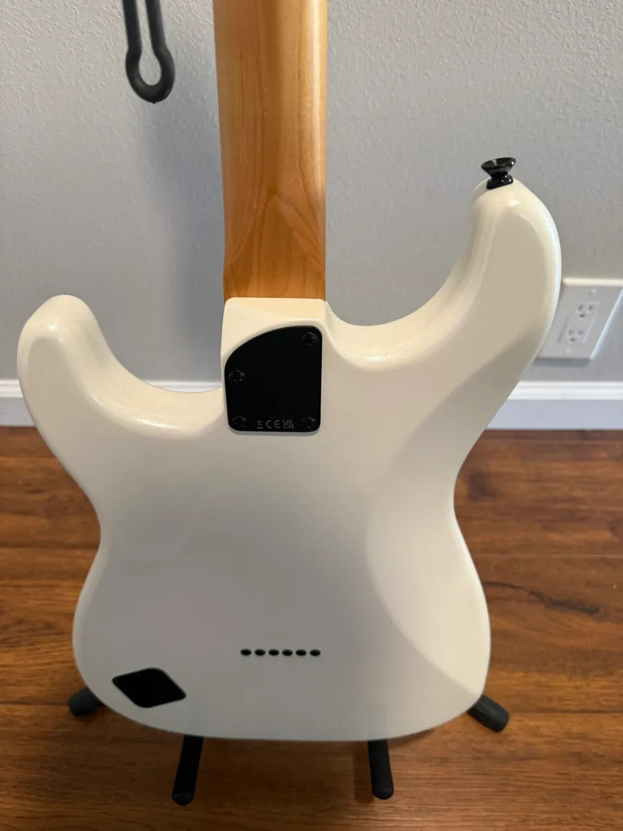 Used Squier Contemporary Stratocaster in pearl white finish, showcasing its sleek body and classic design features.