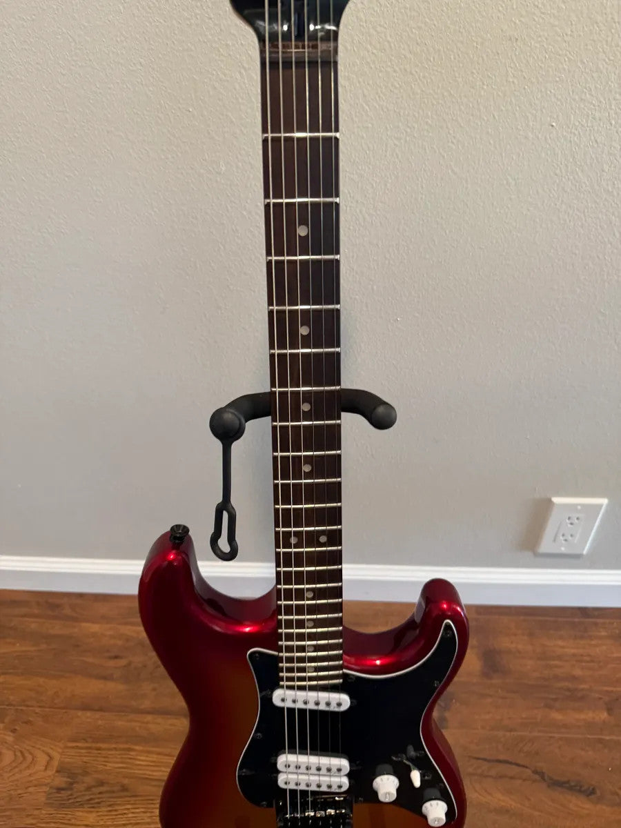 Used Squier Contemporary Stratocaster in Sunset Metallic finish with a glossy body and sleek design.