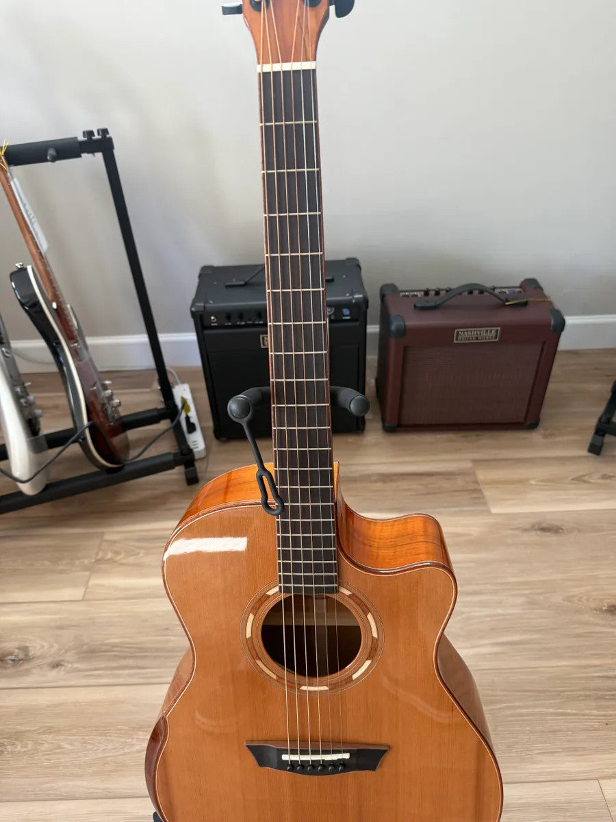 Used Washburn Comfort Series WCG66SCE acoustic electric guitar with a natural finish and elegant body shape.