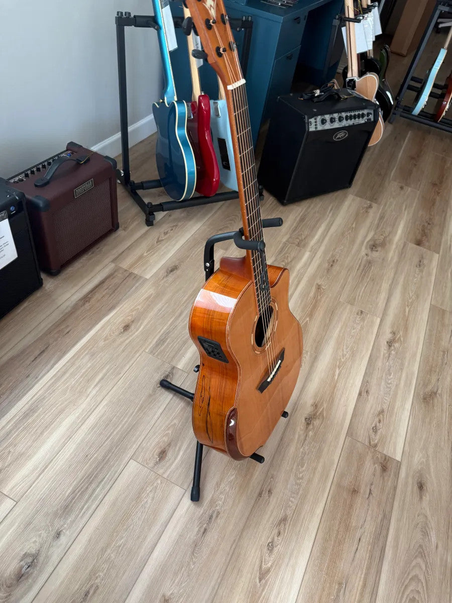 Used Washburn Comfort Series WCG66SCE acoustic electric guitar with a natural wood finish and cutaway design.