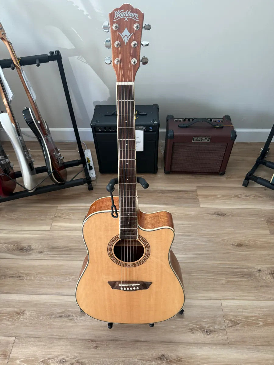 Used Washburn Dreadnaught WD7SCE acoustic electric guitar with a sunburst finish and natural wood grain.