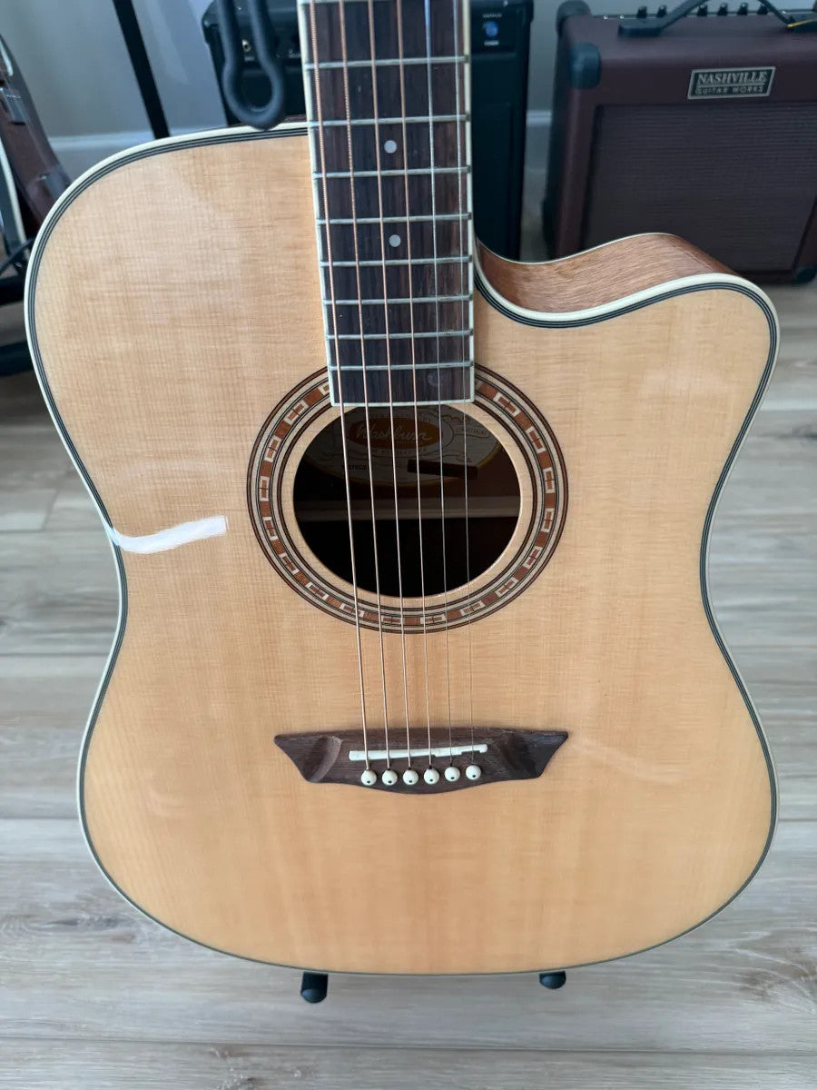 Used Washburn WD7SCE acoustic electric guitar with a dreadnought body and natural wood finish.