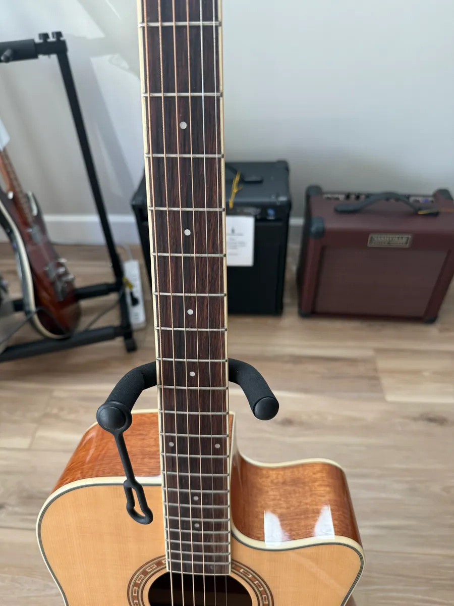 Used Washburn Dreadnaught WD7SCE Acoustic Electric Guitar with a natural wood finish and cutaway body design.