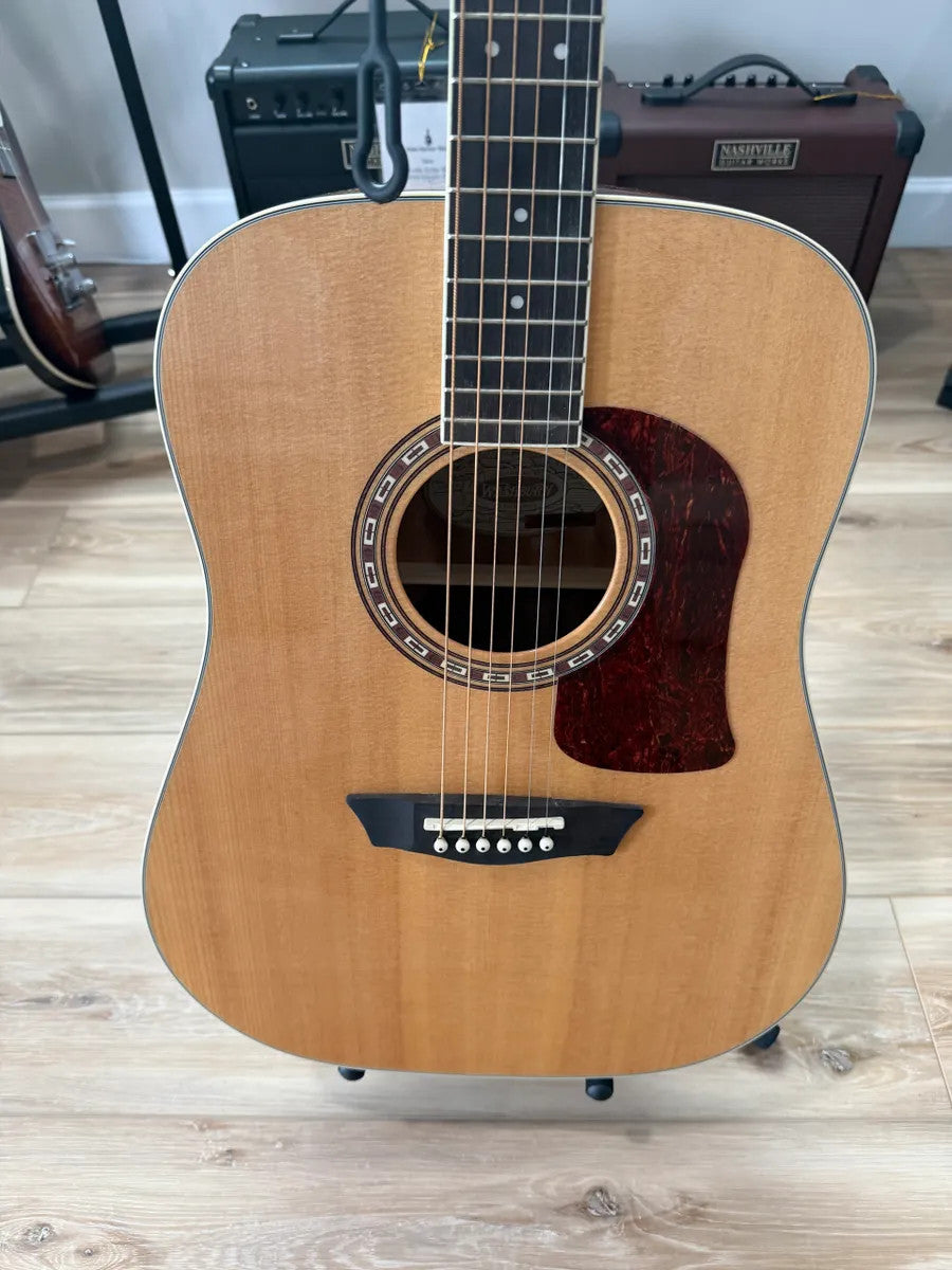 Used Washburn HD10S Heritage Acoustic Guitar with a sunburst finish and detailed wood grain.