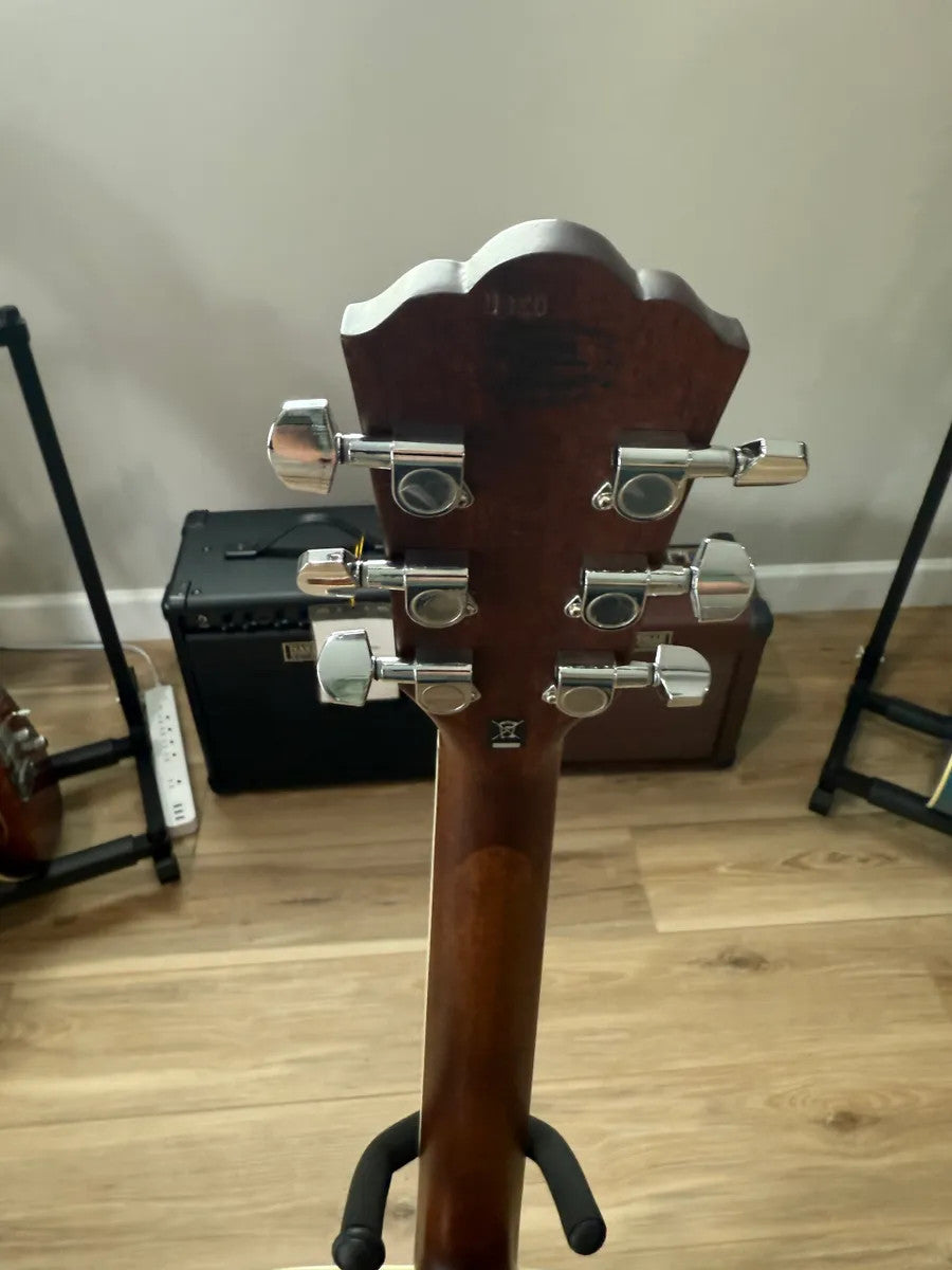 Used Washburn HD10S Heritage Acoustic Guitar with natural wood finish and classic design, showcasing its body and neck.
