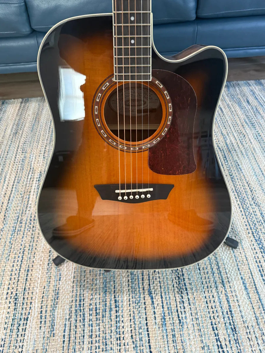 Used Washburn HD10SCETB Heritage Series cutaway acoustic-electric guitar with a sunburst finish and natural wood grain.