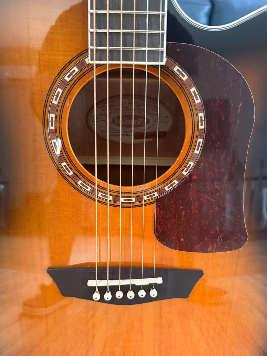 Used Washburn HD10SCETB Heritage Series acoustic guitar with cutaway design and rich wood finish.
