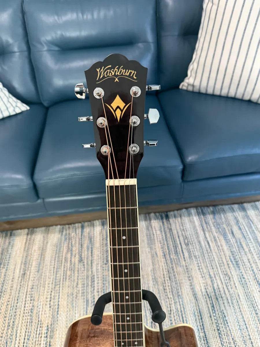 Used Washburn HD10SCETB Heritage Series Cutaway acoustic guitar with natural finish and elegant body shape.