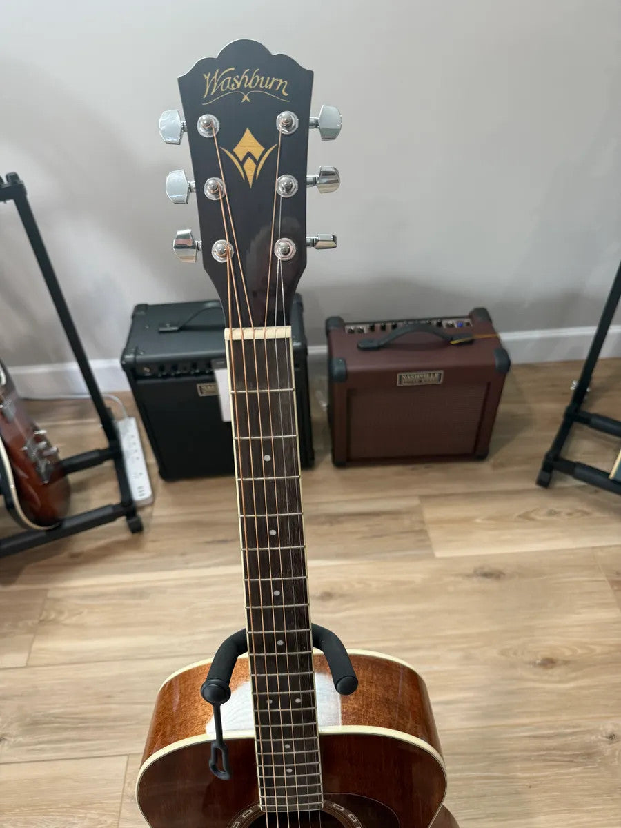 Used Washburn HG12SO WEK Heritage Acoustic Guitar with a glossy finish and elegant wood grain on the body.