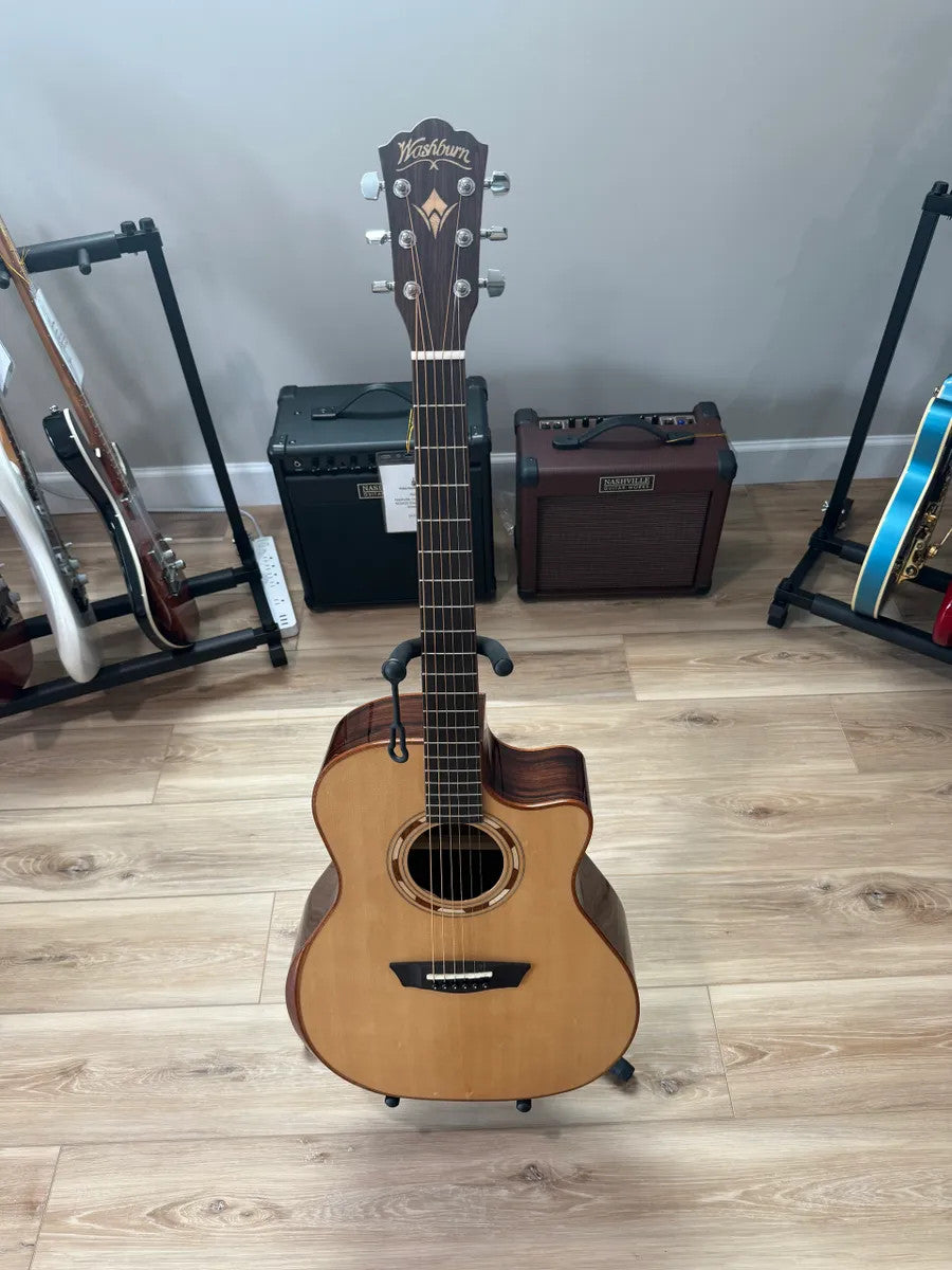 Used Washburn WCG20SCE Comfort Acoustic Electric Guitar with natural wood finish and cutaway body design.