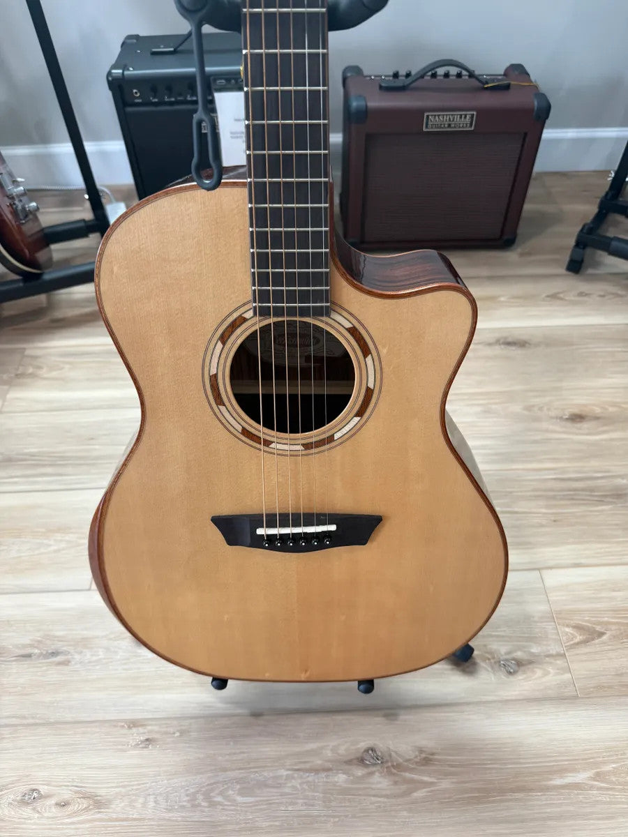 Used Washburn WCG20SCE Comfort Acoustic Electric Guitar with a natural finish and sleek body design.