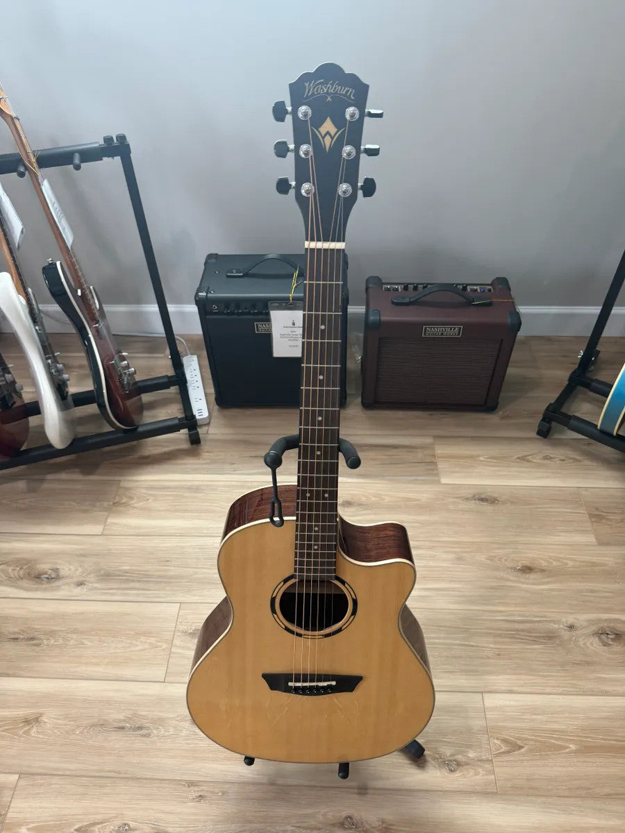 Used Washburn WLO20SCE Woodline acoustic electric guitar with natural wood finish and cutaway design.