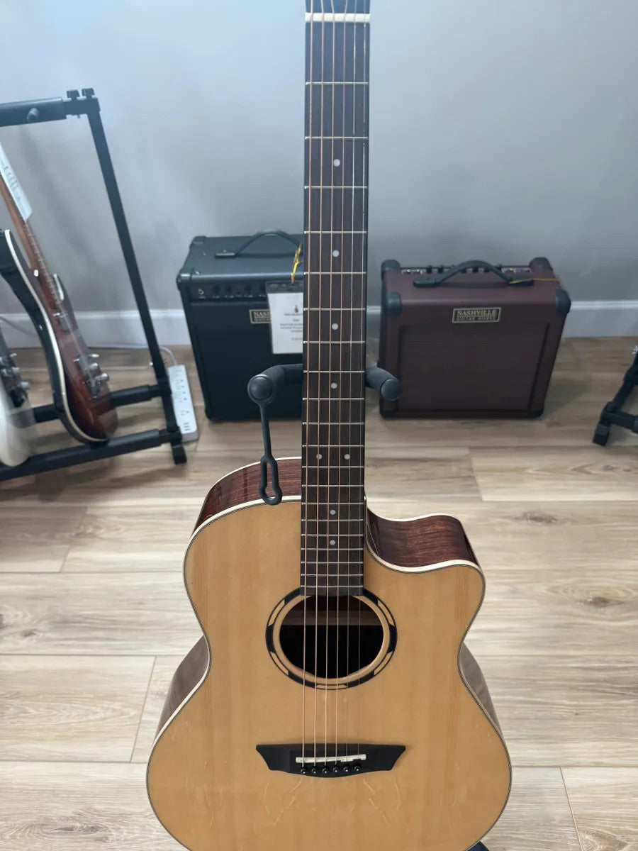 Used Washburn WLO20SCE acoustic electric guitar in natural wood finish with a cutaway design and sleek body shape.