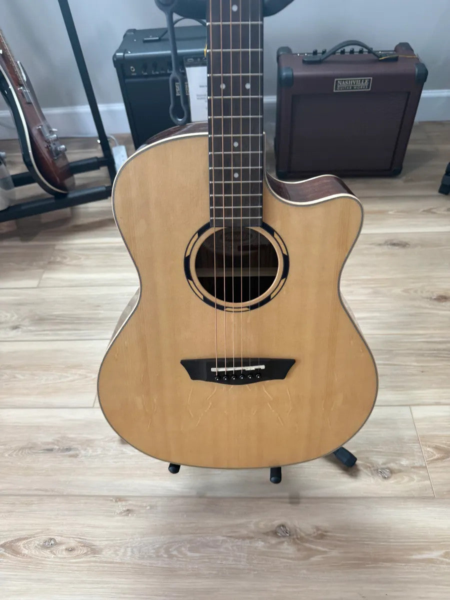 Used Washburn WLO20SCE acoustic electric guitar with natural wood finish and cutaway design, showcasing its elegant body shape.