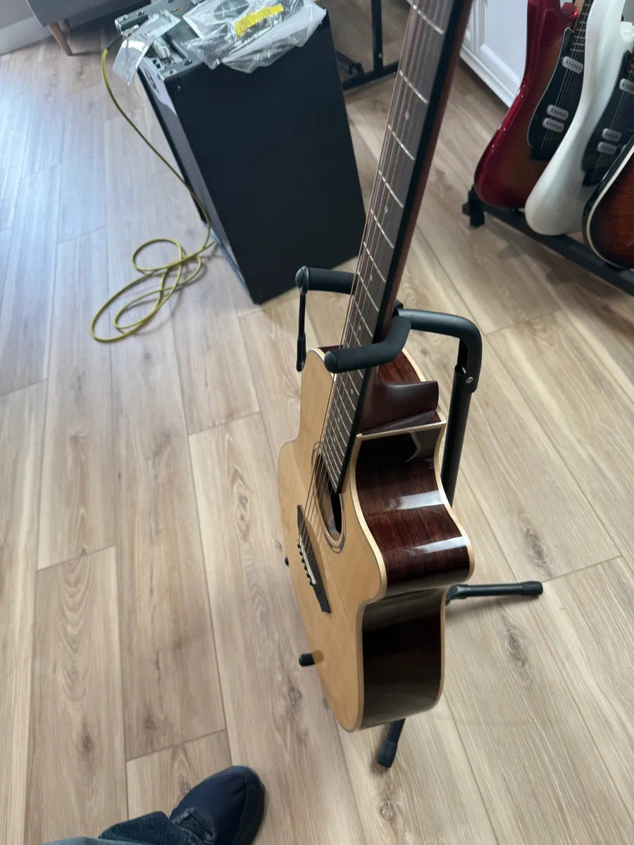 Used Washburn WLO20SCE Woodline acoustic electric guitar with natural wood finish and cutaway body design.