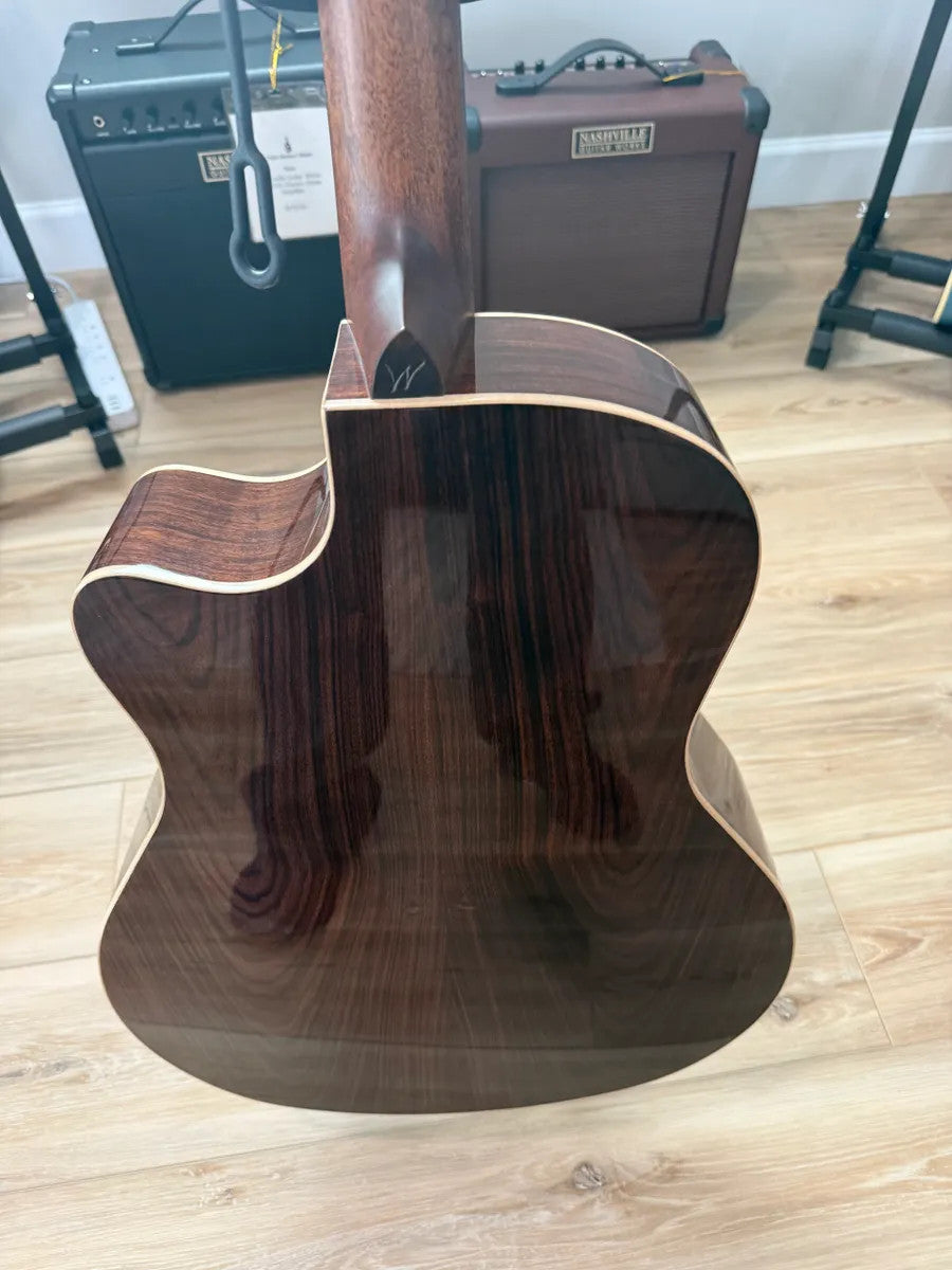 Used Washburn WLO20SCE Woodline acoustic electric guitar showcasing body shape and natural wood finish.